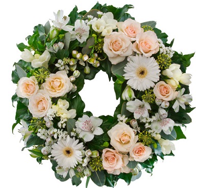 Round funeral wreath with fresh flowers