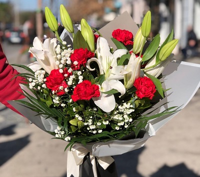 Bouquet with red carnations and lilies