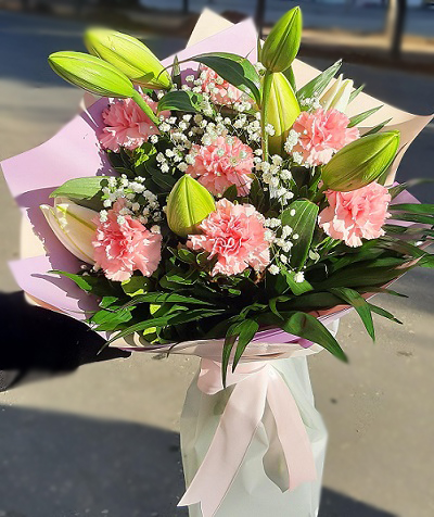 Mix bouquet with pink carnations and white lilies